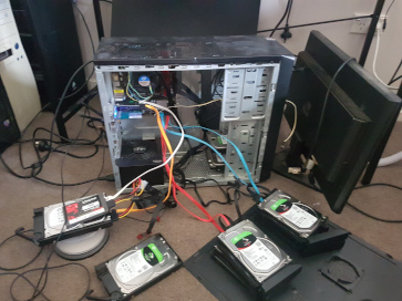 A gutted Windows machines with all the NAS drives connected