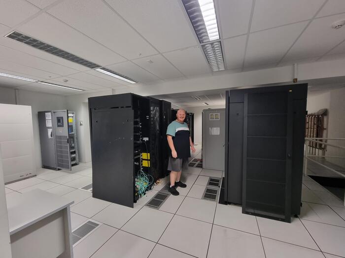 Me standing in a server room that I wouldn't know how to handle